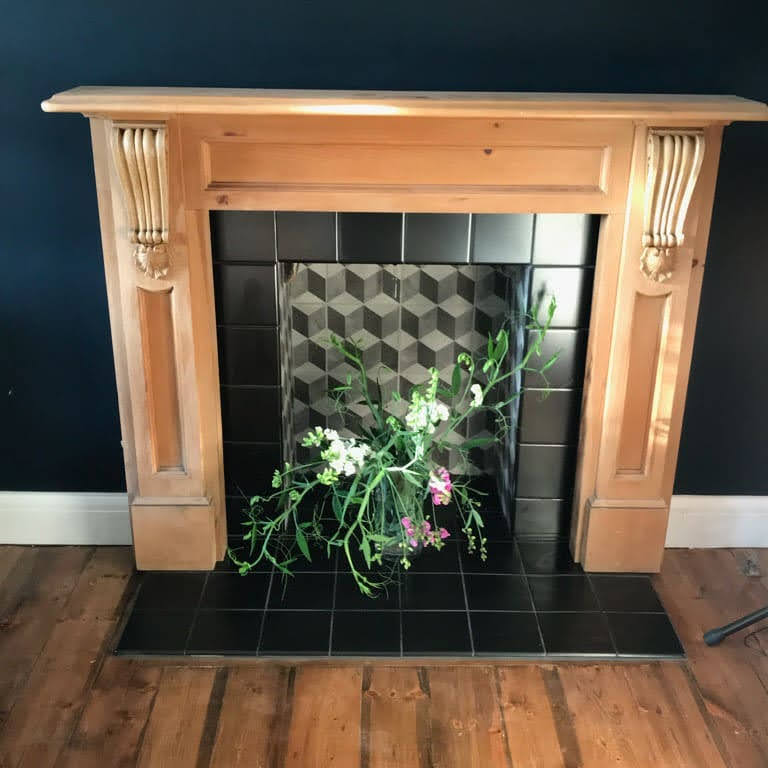 hexagonal effect ceramic tiling in a Fireplace