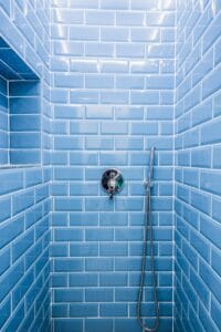 Blue metro tiles in a shower room