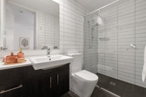 Long white subway tiles in an en-suite bathroom
