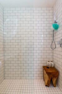 White metro tiles in a walk in shower room