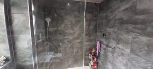 large dark grey stone effect tiles in a bathroom