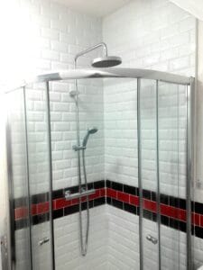 Small wall and floor tiles in a shower cubicle