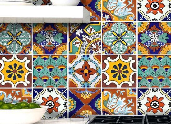 Small multi-coloured ceramic tiles used as a kitchen splashback