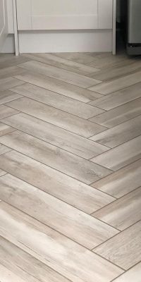 Herringbone wood effect tile flooring in a kitchen