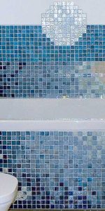 blue mosaic tiles in an ocean design on the wall around a white bath and also bath panel