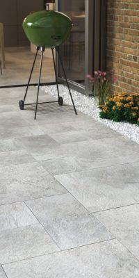 Light grey porcelain outdoor tiling in back garden
